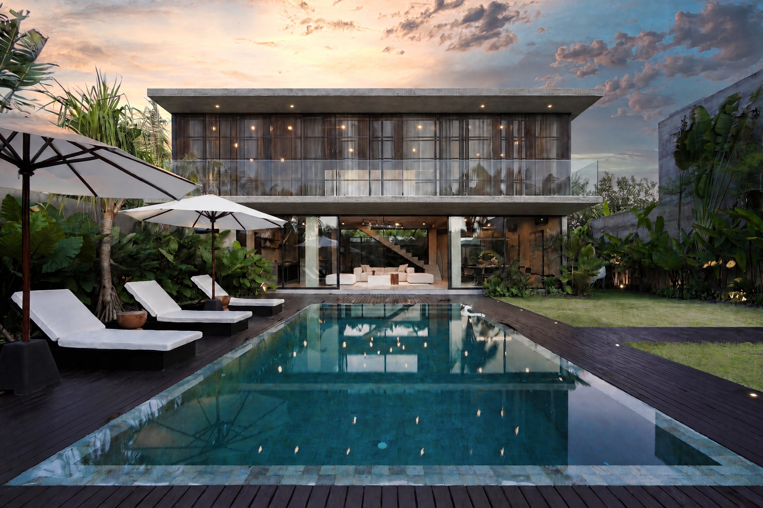 The Core Villas main building with its full-width balcony, seen across the pool (visualisation on the reference villa photo)